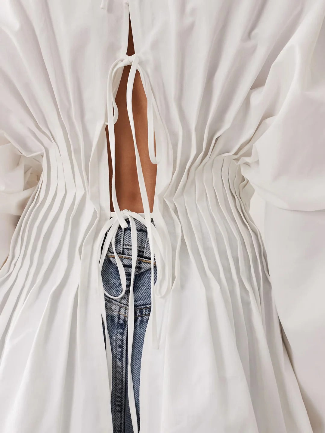 Modern Pintuck Open-Back Peplum Blouse